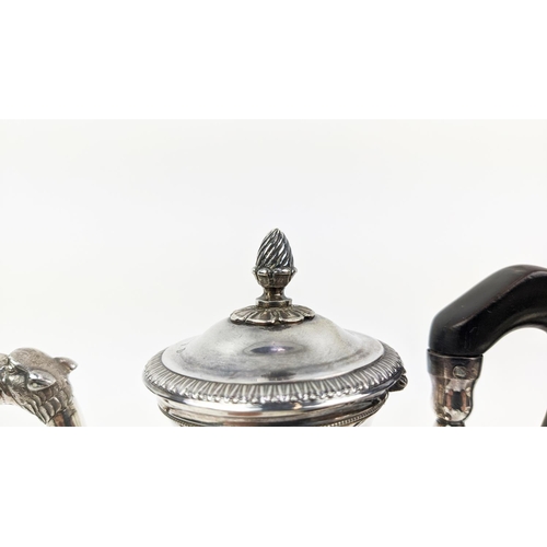 6 - A WHITE METAL HOT WATER POT, on three claw feet, together with a Rococo style salver on claw and bal... 