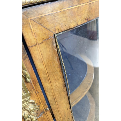 490 - CREDENZA, Victorian walnut, inlaid and brass mounted with a door flanked by bowed glazed doors enclo... 