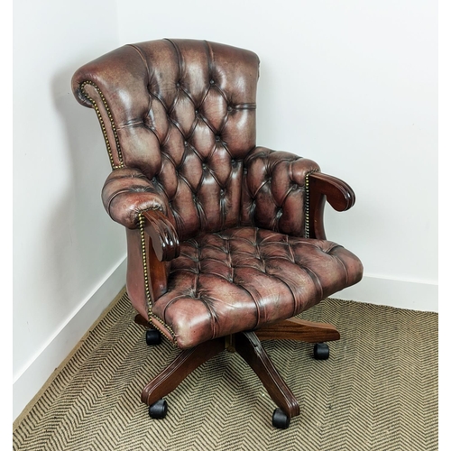 491 - DESK CHAIR, mahogany and faded burgundy leather with height adjustable swivel seat on castors, 68cm ... 