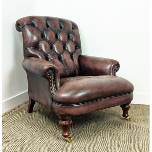 492 - FLEMING AND HOWLAND CHESTERFIELD ARMCHAIR, mahogany and burgundy leather on brass castors, 98cm H x ... 