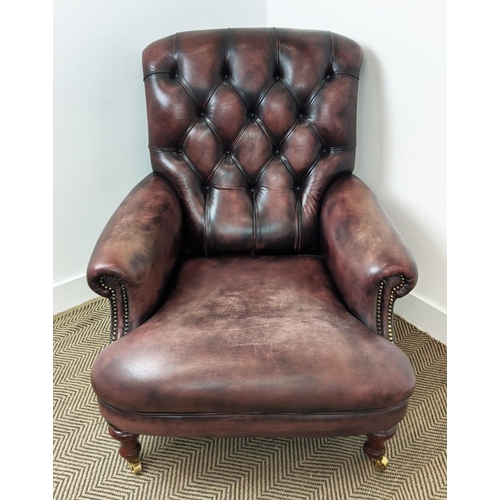 492 - FLEMING AND HOWLAND CHESTERFIELD ARMCHAIR, mahogany and burgundy leather on brass castors, 98cm H x ... 