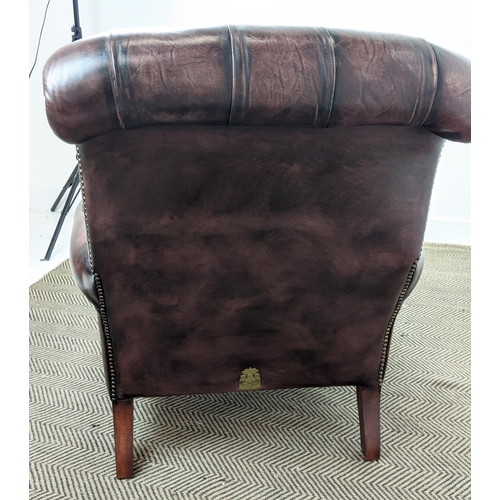 492 - FLEMING AND HOWLAND CHESTERFIELD ARMCHAIR, mahogany and burgundy leather on brass castors, 98cm H x ... 