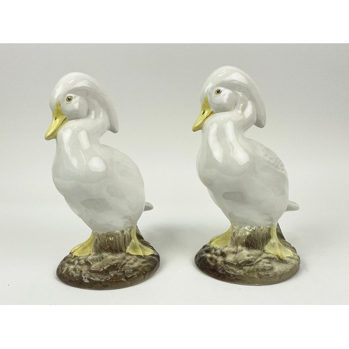 19 - CRESTED DUCKS, a pair, hand modelled ceramic, 28cm H. (2)