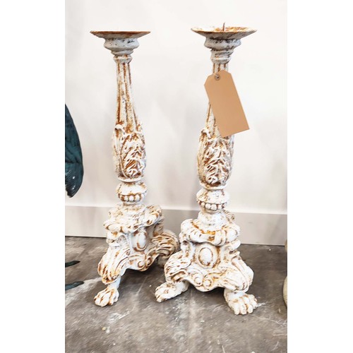 505 - CAST METAL CANDLE STICKS, a pair, 66cm H. (2)