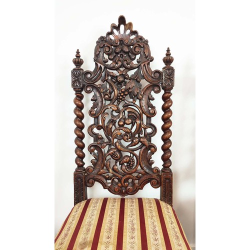 484 - DINING CHAIRS, a set of four, late 19th century Carolean style oak with carved backs and striped sea... 