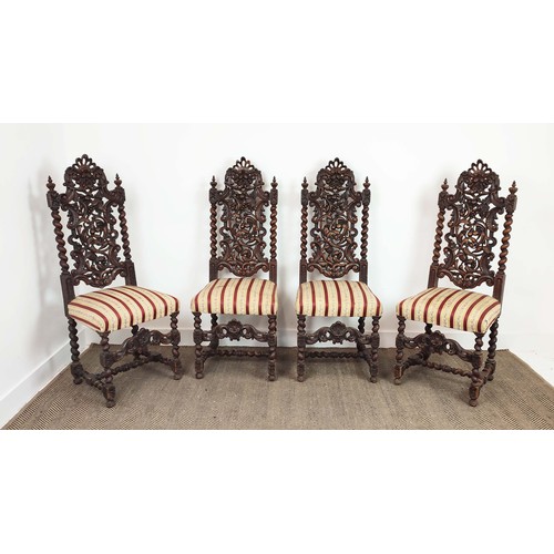 484 - DINING CHAIRS, a set of four, late 19th century Carolean style oak with carved backs and striped sea... 