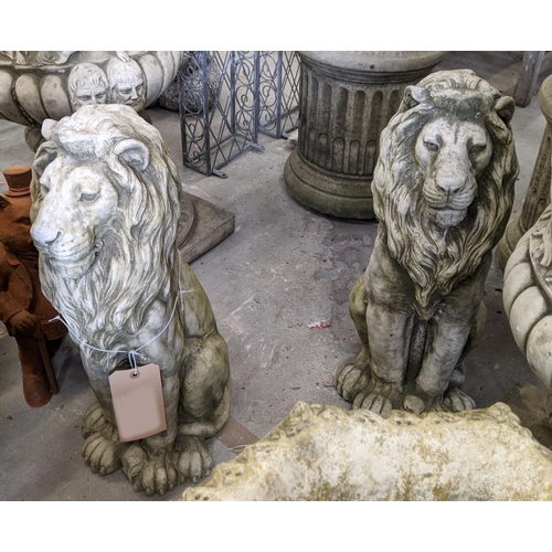 402 - COMPOSITE STONE LIONS, a pair, 58cm H. (2)