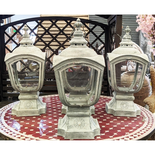 506 - STORM LANTERNS, a set of four, 66cm H.