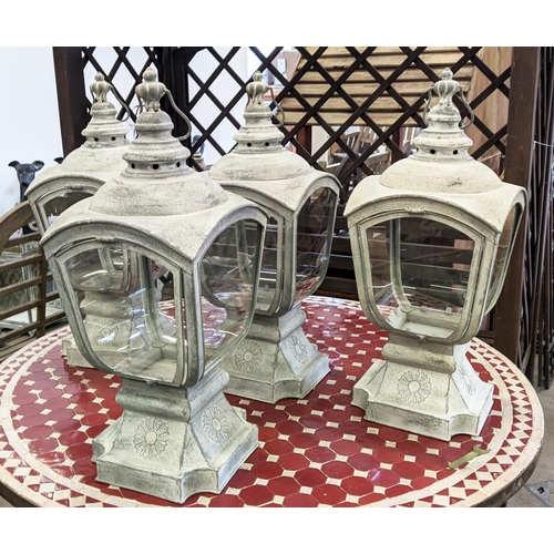 506 - STORM LANTERNS, a set of four, 66cm H.