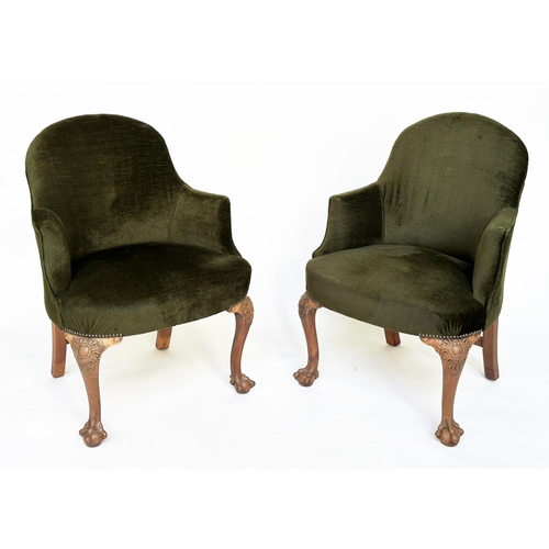 205 - ARMCHAIRS, a pair, early 20th century tub form moss green velvet upholstered each with carved walnut... 