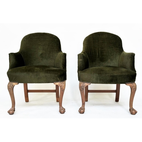 205 - ARMCHAIRS, a pair, early 20th century tub form moss green velvet upholstered each with carved walnut... 