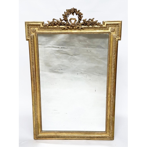 207 - WALL MIRROR, 19th century French rectangular giltwood and gesso moulded with beaded and rosette fram... 