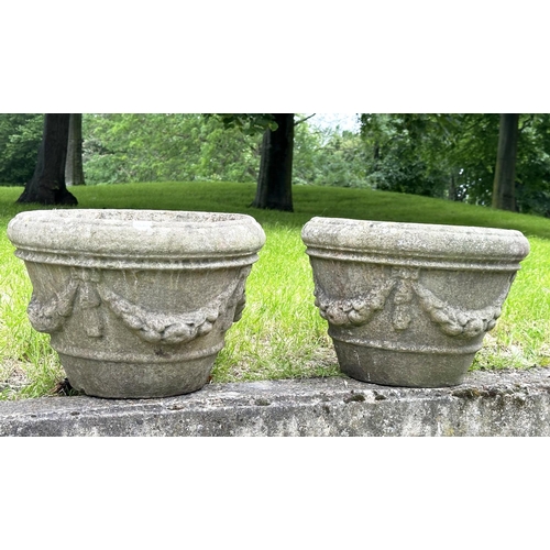 211 - GARDEN PLANTERS,  a pair, well weathered reconstituted stone each round with swag decoration, 35cm H... 