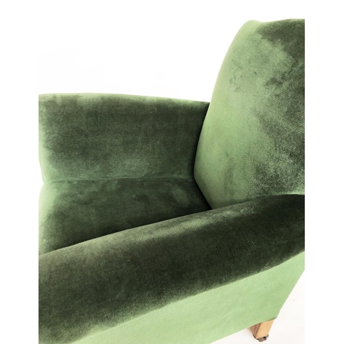 215 - ARMCHAIR, early 20th century Edwardian green velvet upholstered with scroll arms and outswept suppor... 