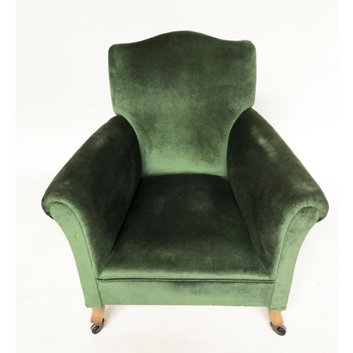 215 - ARMCHAIR, early 20th century Edwardian green velvet upholstered with scroll arms and outswept suppor... 