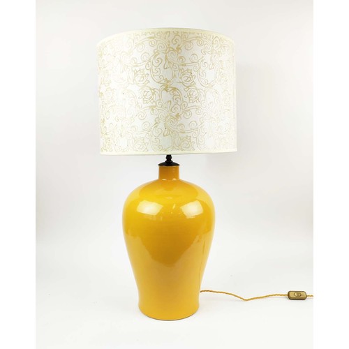 21 - LARGE CERAMIC TABLE LAMP, yellow glazed finish, inverted baluster form, complete with shade.