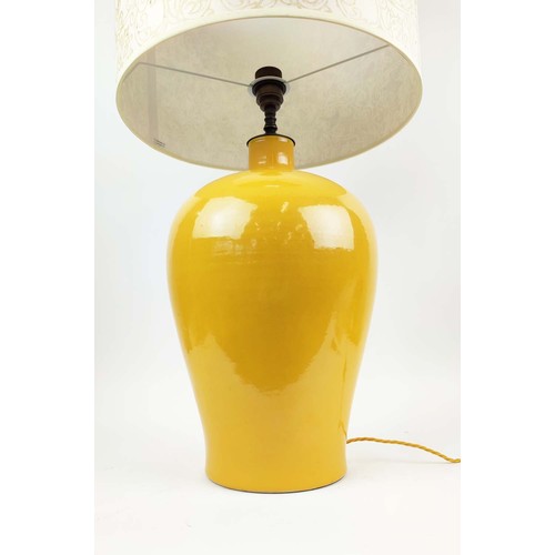 21 - LARGE CERAMIC TABLE LAMP, yellow glazed finish, inverted baluster form, complete with shade.