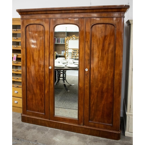 191 - WARDROBE, Victorian mahogany with mirrored door flanked by panel doors enclosing hanging rail and dr... 