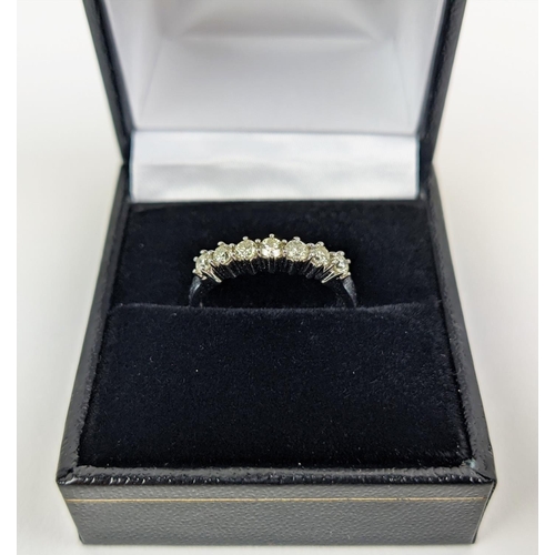 17 - AN 18CT WHITE GOLD SEVEN STONE DIAMOND RING, the round brilliant cut diamonds of approximately 0.50 ... 