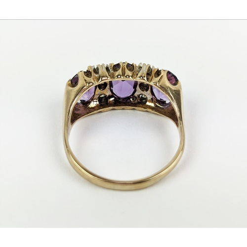 18 - A 9CT GOLD AMETHYST AND DIAMOND DRESS RING, set with three mixed cut amethysts with diamond set spac... 