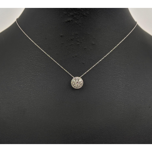 19 - A 9CT WHITE GOLD DIAMOND SET CLUSTER NECKLACE, set with round brilliant cut diamonds of approximatel... 