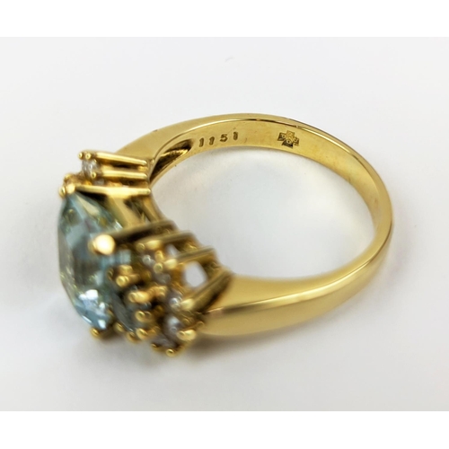 22 - AN 18CT GOLD AQUAMARINE AND DIAMOND SET DRESS RING, set with one large aquamarine and two smaller st... 