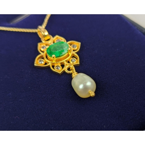 26 - A YELLOW METAL EMERALD AND PEARL SET PENDANT NECKLACE, gold plated chain, complete with box