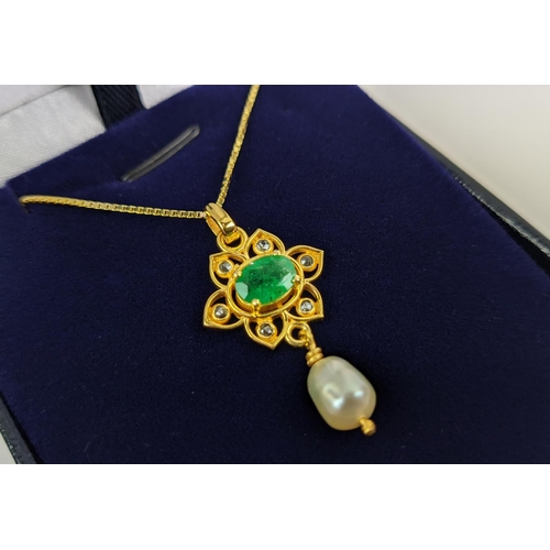 26 - A YELLOW METAL EMERALD AND PEARL SET PENDANT NECKLACE, gold plated chain, complete with box