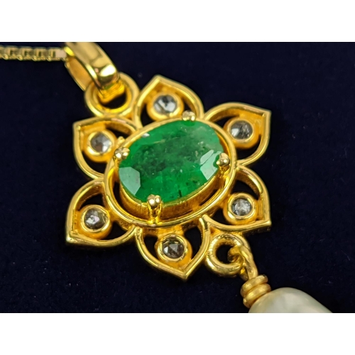 26 - A YELLOW METAL EMERALD AND PEARL SET PENDANT NECKLACE, gold plated chain, complete with box