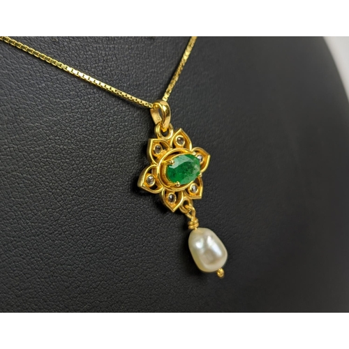 26 - A YELLOW METAL EMERALD AND PEARL SET PENDANT NECKLACE, gold plated chain, complete with box