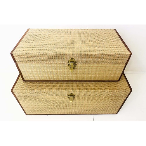 383 - TRUNKS, a graduated set of two, woven upholstered finish, largest 65cm W x 31cm H. (2)