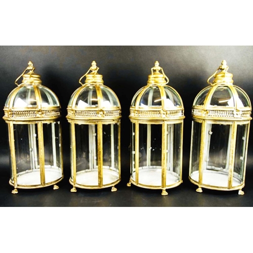 385 - STORM LANTERNS, a set of four, Regency style, gilt metal and glass, 46cm H x 19cm. (4)