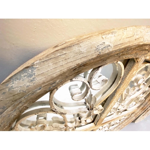 305 - ARCHITECTURAL WALL MIRRORS, a pair, circular, distressed painted frames, 72cm diam. (2)