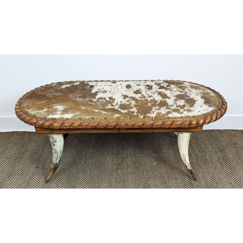 411 - LOW TABLE, hide upholstered top, horn supports, 120cm x 62cm x 47cm.