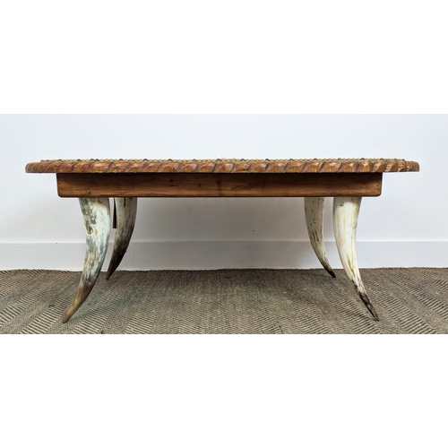 411 - LOW TABLE, hide upholstered top, horn supports, 120cm x 62cm x 47cm.