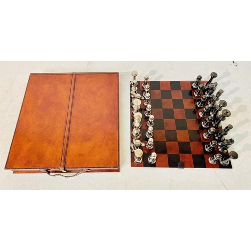 422 - CHESS SET, in leathered case, 7cm x 43cm x 41cm.