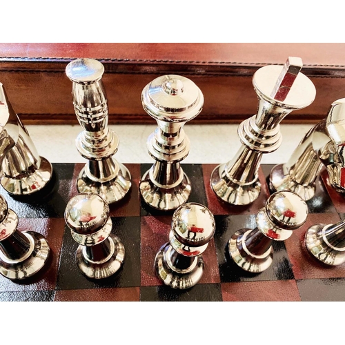 422 - CHESS SET, in leathered case, 7cm x 43cm x 41cm.