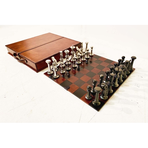 422 - CHESS SET, in leathered case, 7cm x 43cm x 41cm.