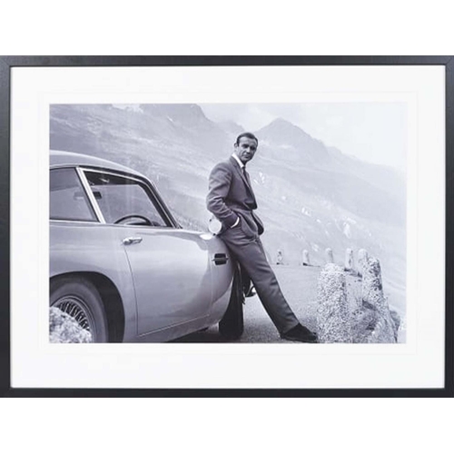 424 - CONTEMPORARY SCHOOL PHOTO PRINT, of James Bond with Aston Martin, framed, 63cm H x 83cm W.