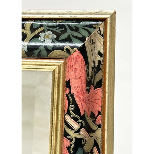 474 - WALL MIRROR, rectangular bevelled with gilded and floral decorated moulded frame, 62cm W x 87cm H.