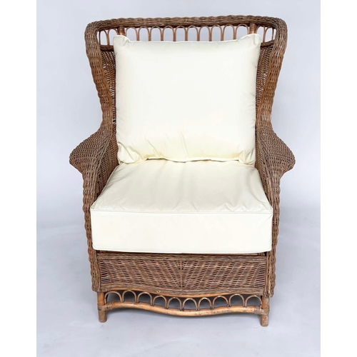 460 - CONSERVATORY ARMCHAIR, mid 20th century, rattan framed and cane woven with shaped back and cushions,... 