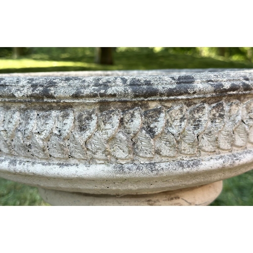 258 - GARDEN STAND, weathered reconstituted stone circular with carved edge on fluted column support, 49cm... 