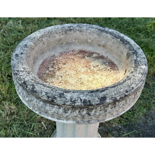 258 - GARDEN STAND, weathered reconstituted stone circular with carved edge on fluted column support, 49cm... 