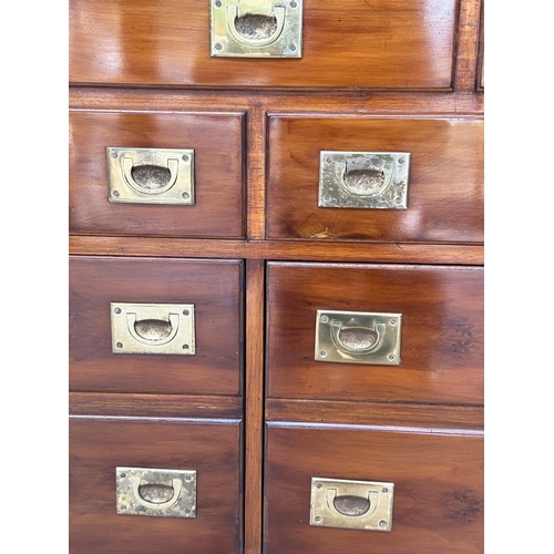 263 - CAMPAIGN STYLE CHEST, yewwood and brass bound with one long drawer above two short drawers, (all dra... 