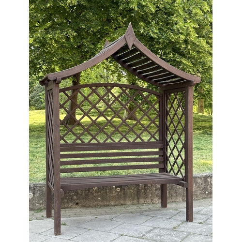253 - GARDEN GAZEBO, vintage with pitched gable roof trellis back and slatted seat with cushion, 220cm H x... 