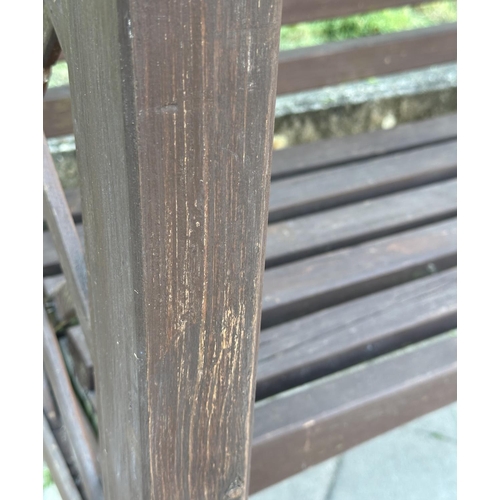 253 - GARDEN GAZEBO, vintage with pitched gable roof trellis back and slatted seat with cushion, 220cm H x... 