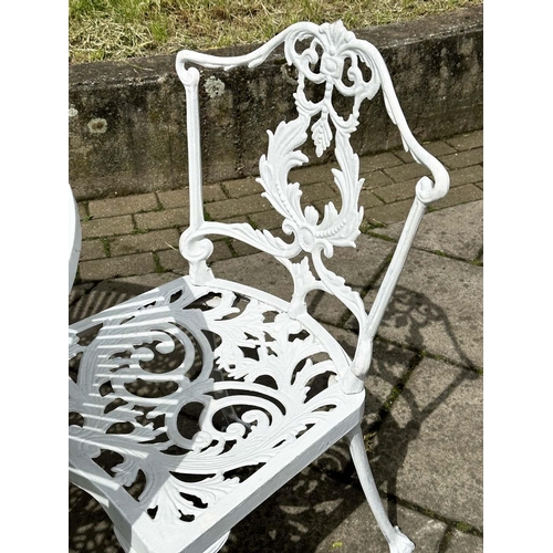 255 - GARDEN TABLE AND CHAIRS, Victorian style distressed white painted, circular with two associated side... 