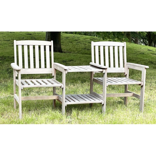 257 - GARDEN CONVERSATION BENCH, well weathered teak, two armchairs with conjoining table, 162cm W.