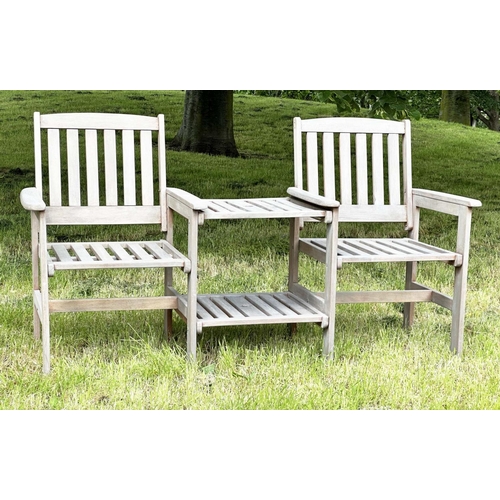 257 - GARDEN CONVERSATION BENCH, well weathered teak, two armchairs with conjoining table, 162cm W.