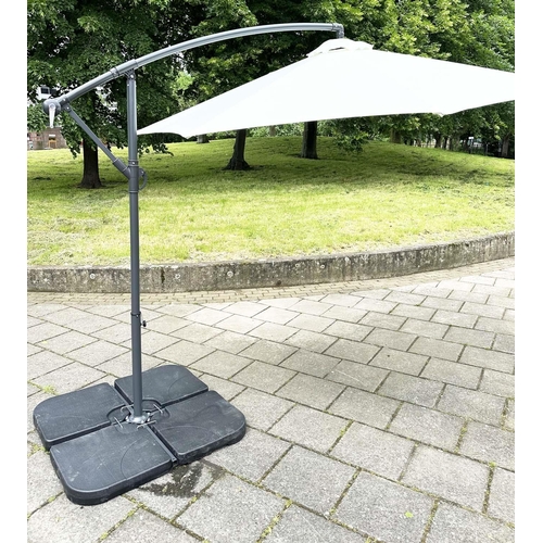251 - SUN UMBRELLA, circular retractable with cantilever wind up support and weighted (water) bases.